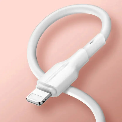 White Lightning charging cable with reinforced connector on a pink background